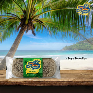 Blue Dragon Soba Noodles pack on wooden surface with tropical beach and palm tree background
