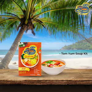 Blue Dragon Tom Yum Soup Kit package and bowl of soup on wooden table with tropical beach background