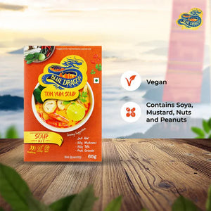 Blue Dragon Tom Yum Soup Kit package on wooden table with vegan and allergen info