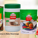 Assorted Lebanese food products including baba ghannouge, hummus, tahina, and falafel mix with a hummus dip bowl and fresh vegetable sticks