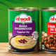Assorted Lebanese food products including baba ghannouge, hummus, tahina, and falafel mix with a hummus dip bowl and fresh vegetable sticks
