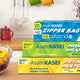 Asahi Kasei premium wrap, zipper bag, frying pan foil, and baking sheet on a table with fruit bowl, promotion for free gift.