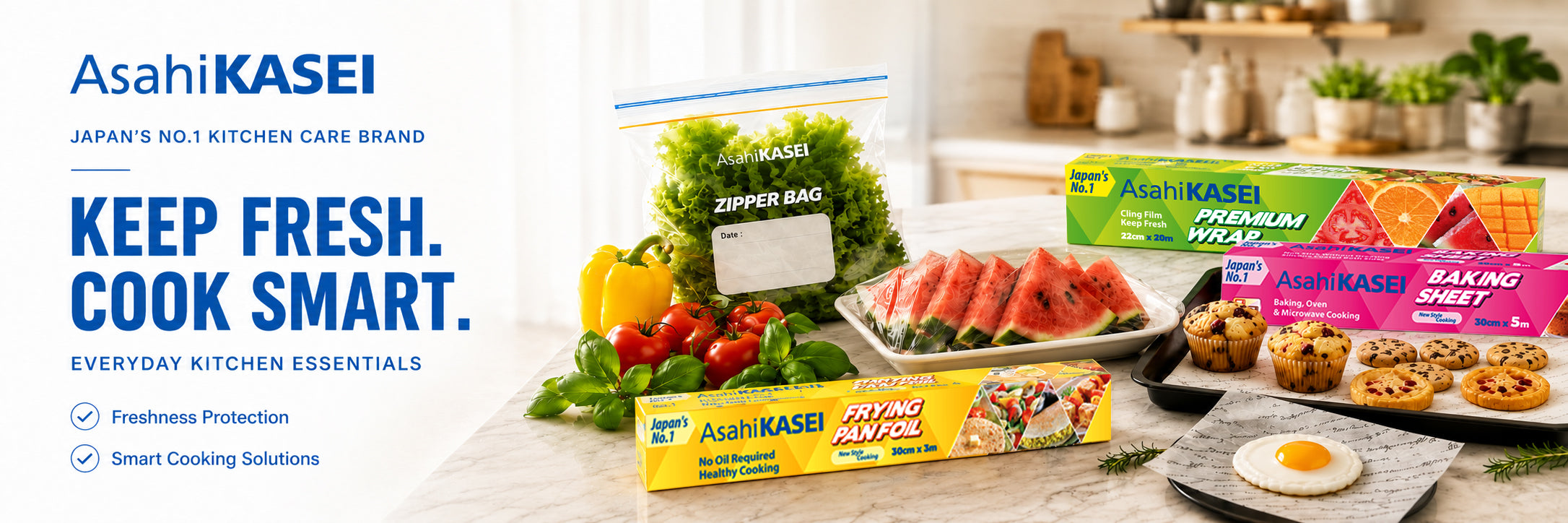 Asahi Kasei premium wrap, zipper bag, frying pan foil, and baking sheet on a table with fruit bowl, promotion for free gift.