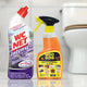 Bathroom and toilet cleaning products on tile floor, sink and toilet in background