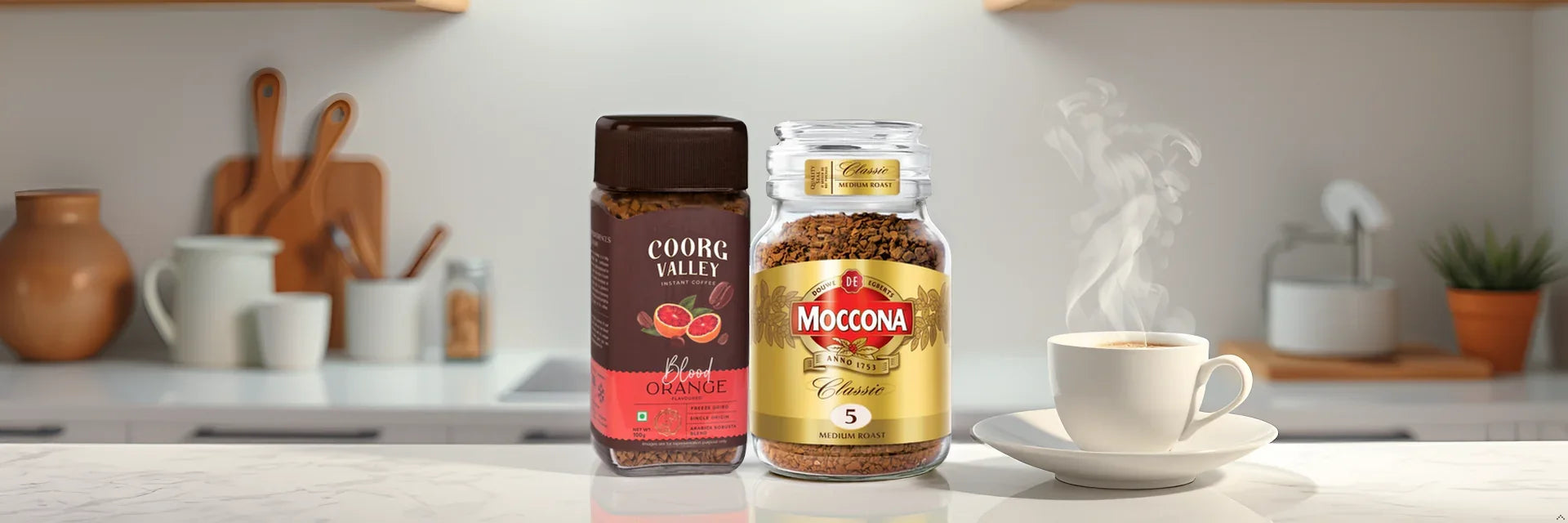 Coorg Valley Blood Orange & Moccona Classic instant coffee jars beside steaming cup on kitchen counter