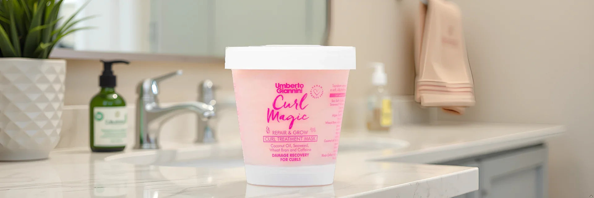 Umberto Giannini Curl Magic Repair & Grow Treatment Mask for curly hair on bathroom counter
