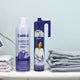 Steam iron, Faultless Lavender Scent spray starch, and Merito Original fabric spray on ironing board with folded linens