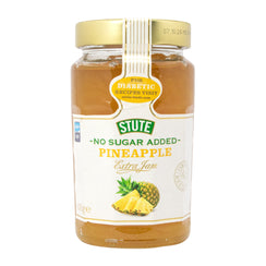 Jar of Stute no sugar added pineapple jam on a white background