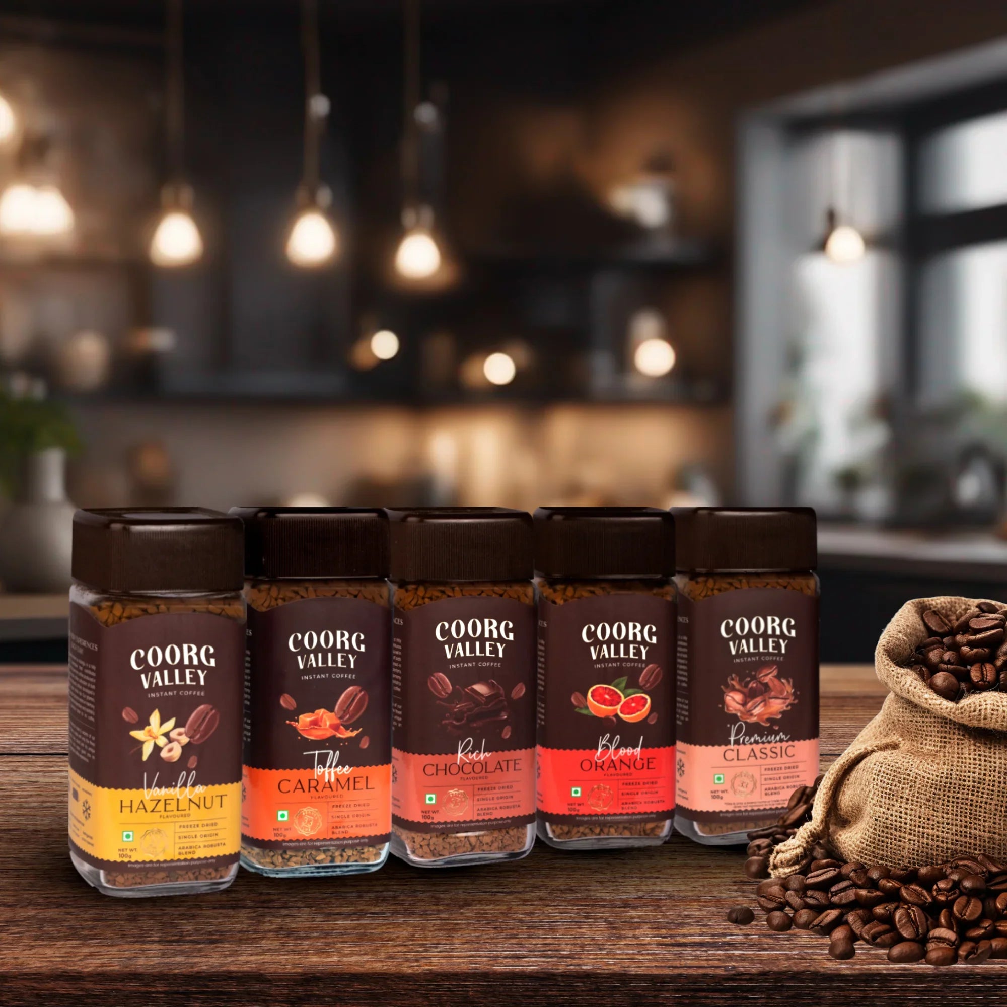 Coorg Valley coffee jars with various flavors on a wooden table in a kitchen setting
