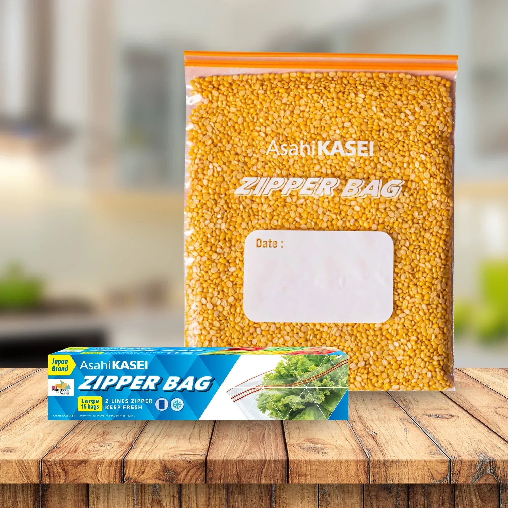 Large clear zipper bag with lentils and product packaging on wooden table in kitchen setting