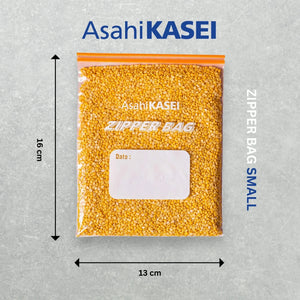 Small transparent zipper bag with orange seal, filled with yellow lentils, labeled 16x13 cm.
