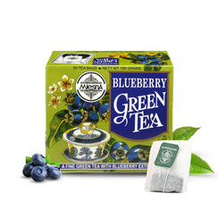 Blueberry green tea box with teacup, loose tea bag, blueberries, and green tea leaves