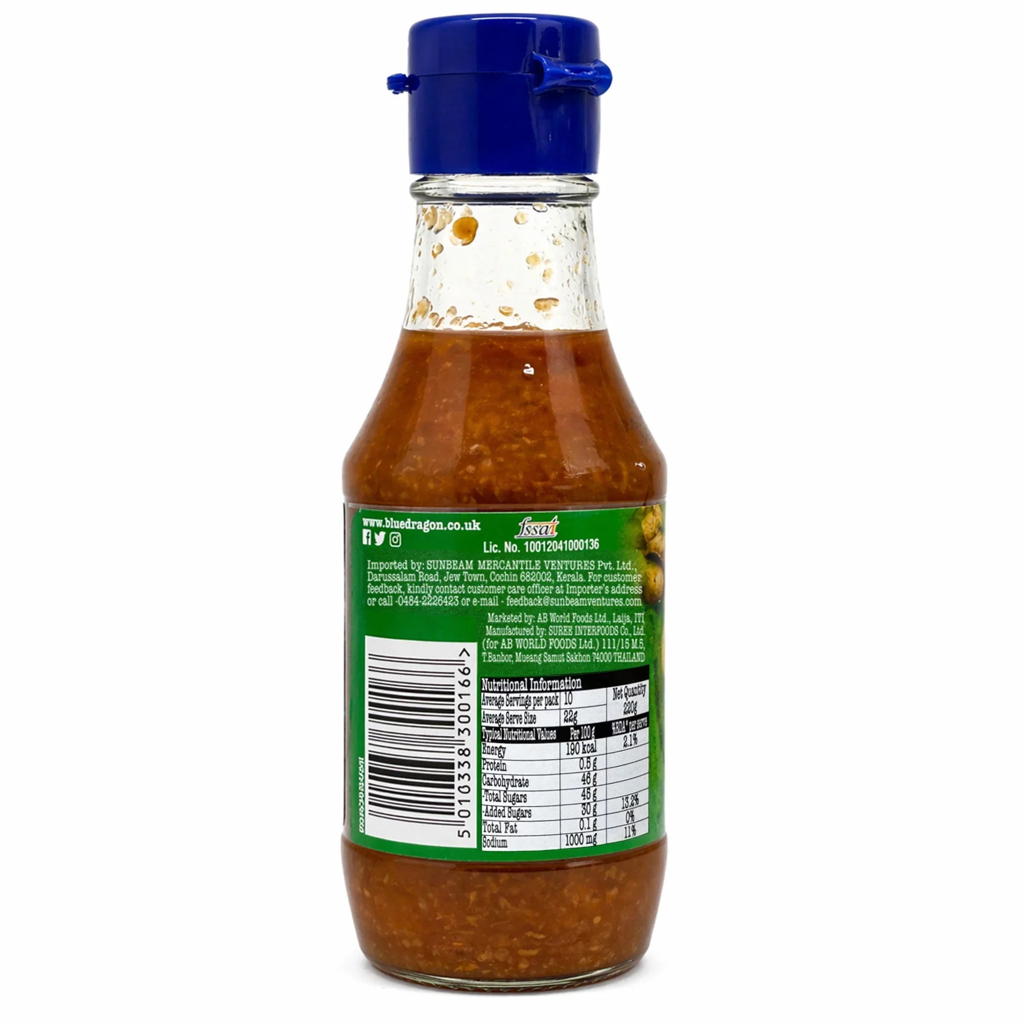 Glass bottle of chilli ginger sauce with blue cap, back view showing label and ingredients