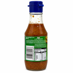 Glass bottle of chilli ginger sauce with blue cap, back view showing label and ingredients