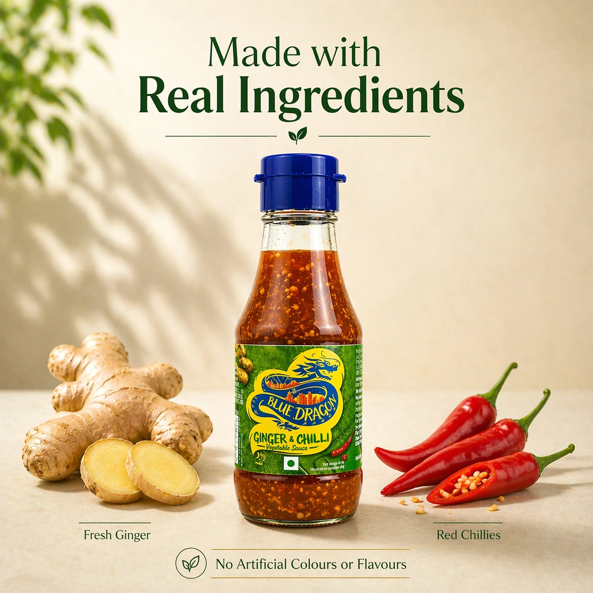 Blue Dragon ginger and chilli sauce bottle with fresh ginger and red chillies