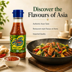 Blue Dragon Ginger & Chilli sauce bottle with stir-fry vegetables and sauce bowl in kitchen setting