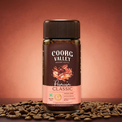 Coorg Valley Premium Classic instant coffee jar with coffee beans on brown background