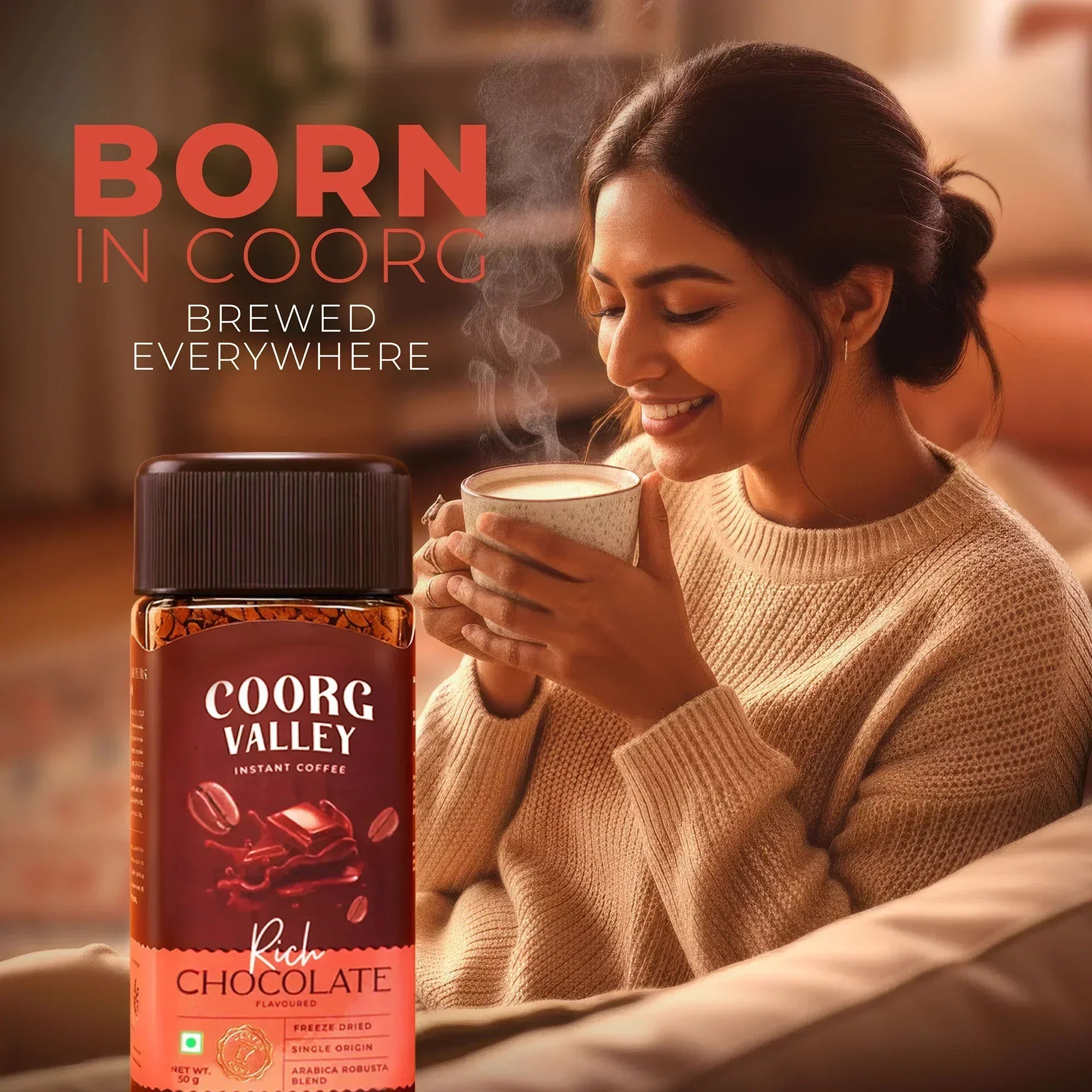 Woman enjoying a hot cup of Coorg Valley Rich Chocolate instant coffee at home.