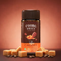 Coorg Valley Toffee Caramel instant coffee jar with caramel cubes and coffee beans