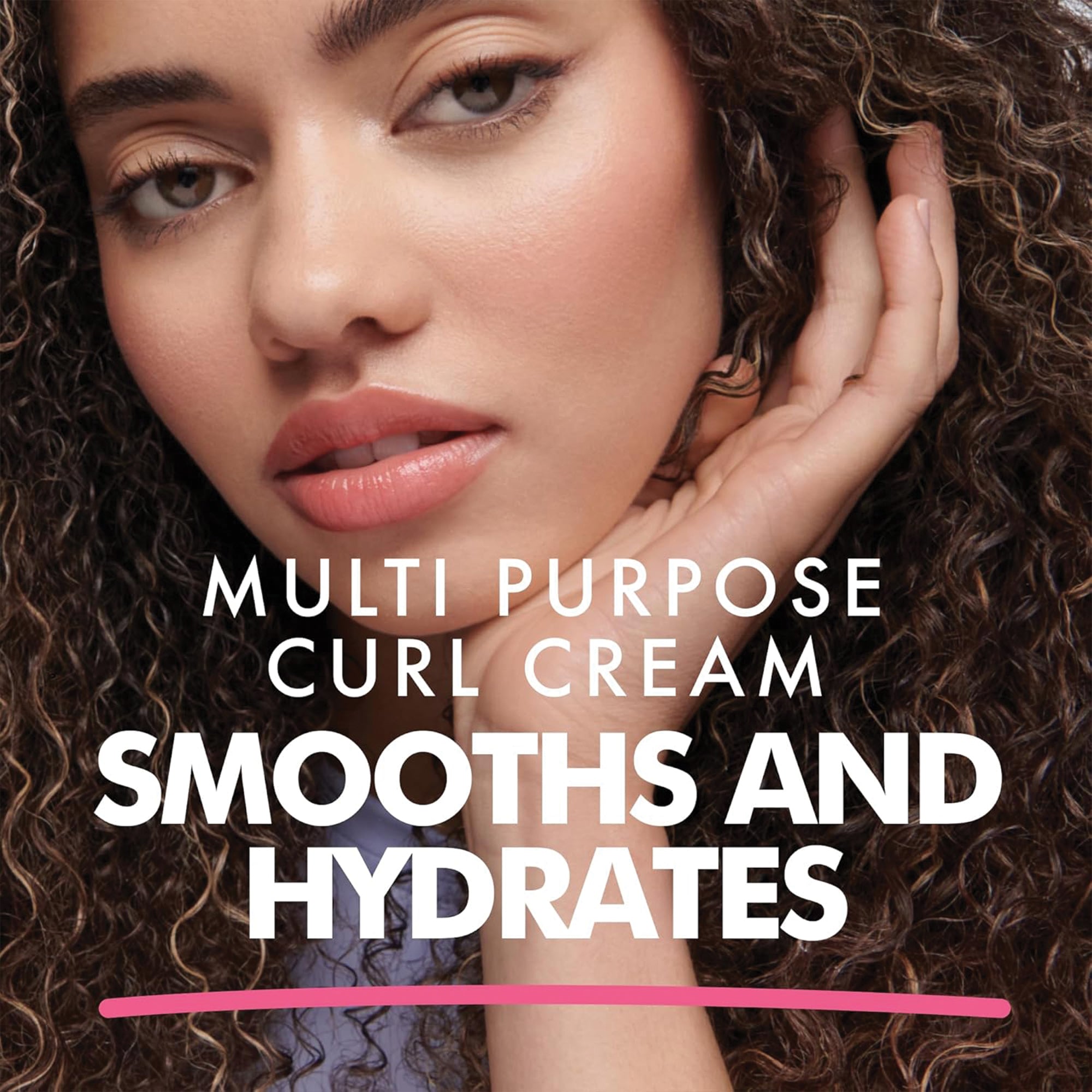 Close-up of woman with curly hair and natural makeup promoting multi-purpose curl cream that smooths and hydrates