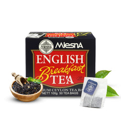 Mlesna English Breakfast tea box with loose black tea, tea bag, and green tea leaves