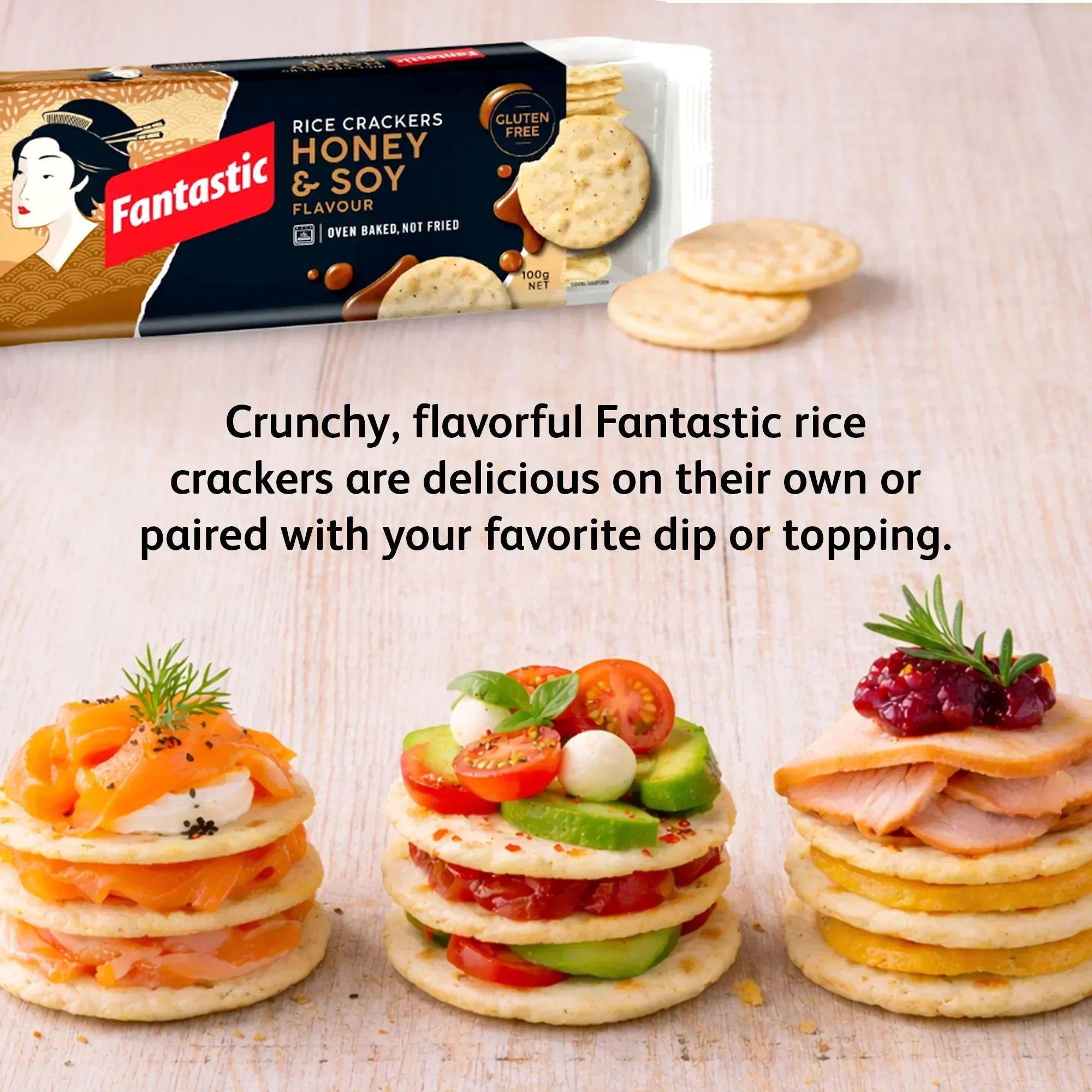 Honey soy rice crackers in a package, with assorted toppings stacked on crackers on a wooden surface.