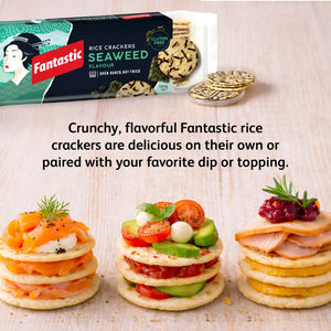 Fantastic seaweed rice crackers with gourmet toppings, gluten free snack on wooden table.