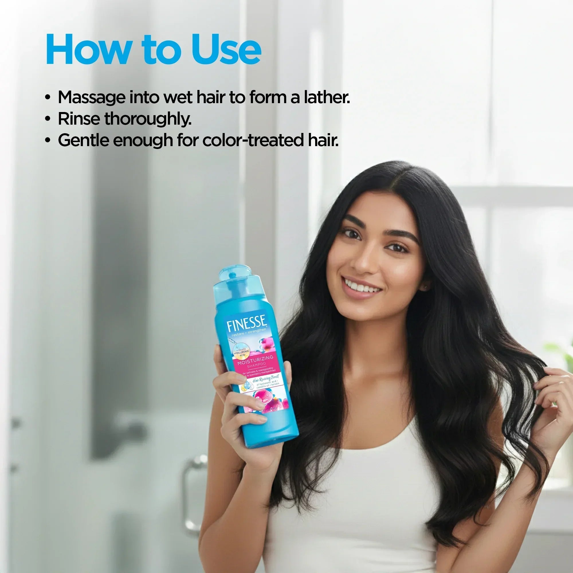 Woman with long hair holding a bottle of Finesse shampoo, with usage instructions displayed.
