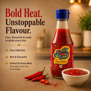 Blue Dragon Hot Chilli Sauce bottle with bold flavor, fiery kick, and fresh red chilies on a kitchen counter