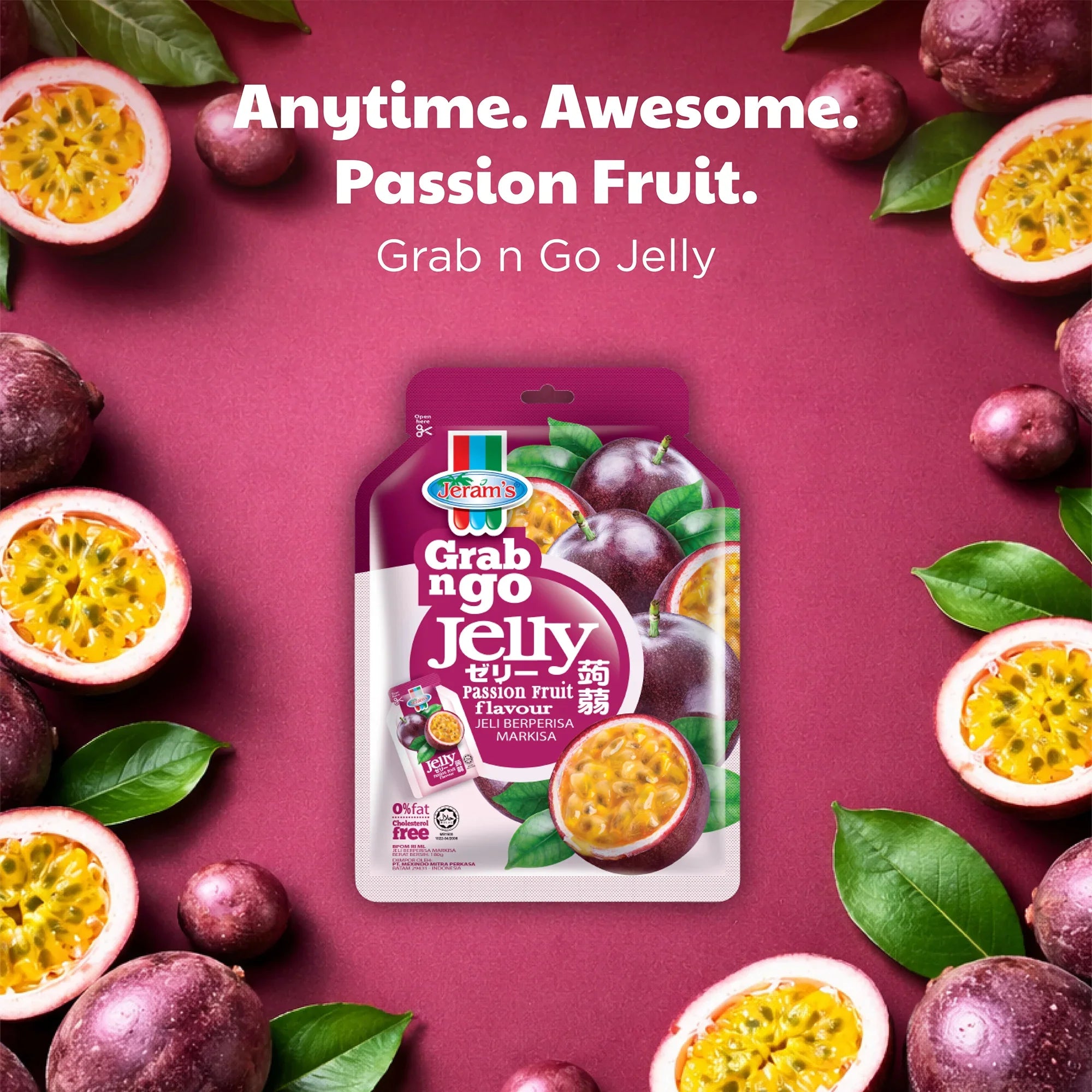 Passion fruit jelly pouch on pink background with fresh passion fruits and green leaves