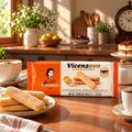Matilde Vicenzi Vicenzovo Italian ladyfinger biscuits package and loose cookies on a wooden table.
