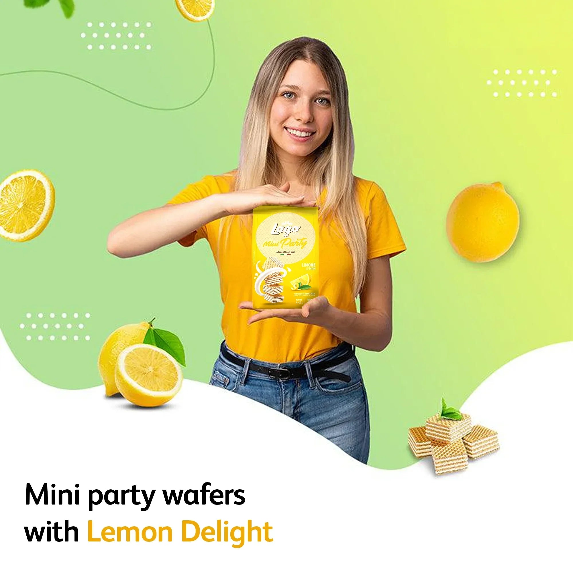 Woman holding Lago Mini Party Wafers Lemon Cream pack with lemons and wafers on green background
