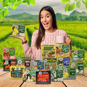 Woman holding a box of lemon green tea among assorted tea boxes in a lush tea plantation.
