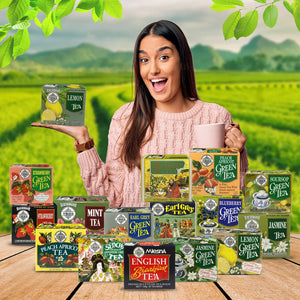 Woman holding lemon tea box with assorted tea varieties in a green tea plantation background