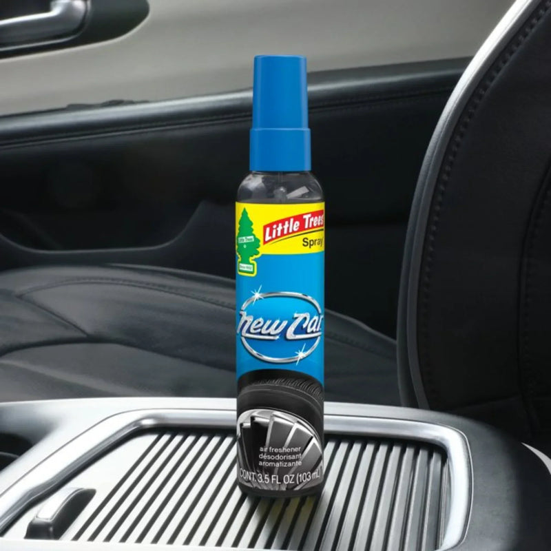 Little Trees New Car Scent Spray air freshener bottle placed on a car console interior