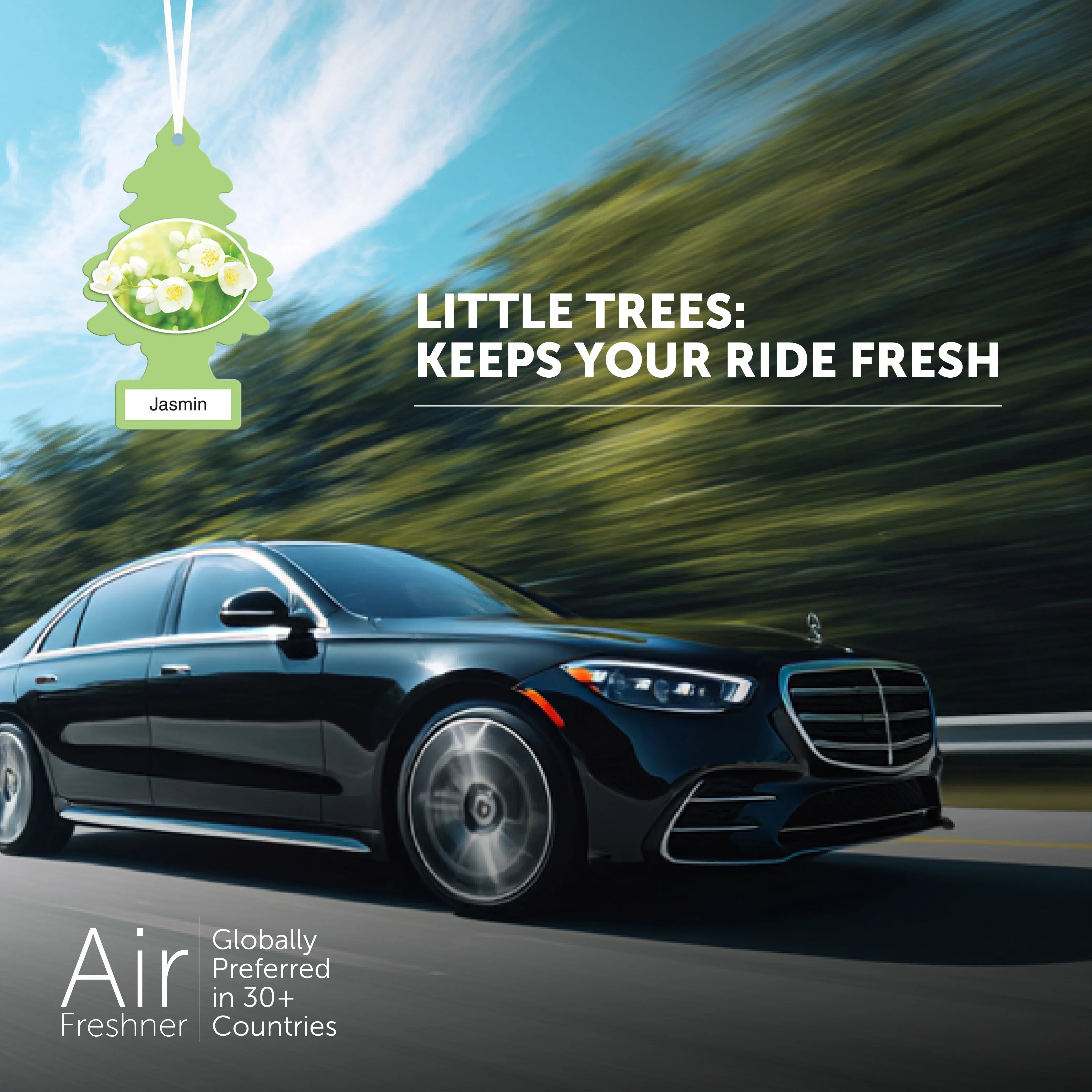 Black luxury car on road with Little Trees Jasmin air freshener and text promoting fresh ride