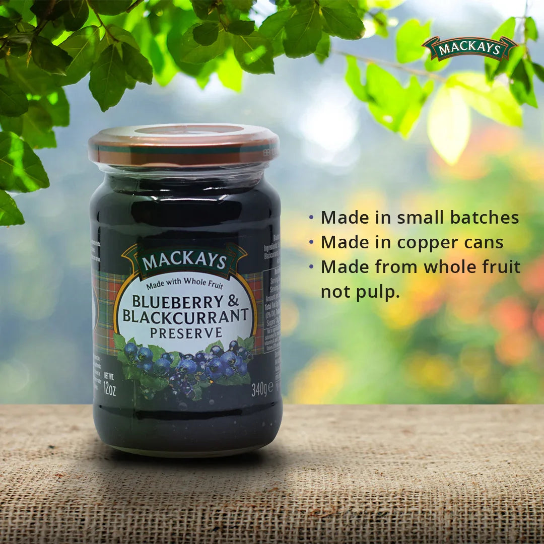 Jar of Mackays Blueberry & Blackcurrant Preserve on burlap with green leaves and product benefits