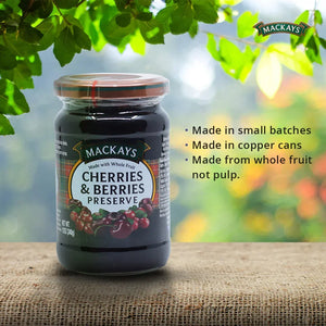 Mackays cherries and berries preserve jar on burlap with green leaves and product features