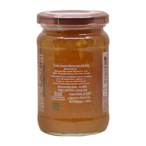 Jar of fruity orange marmalade with metallic lid and clear label showing product details