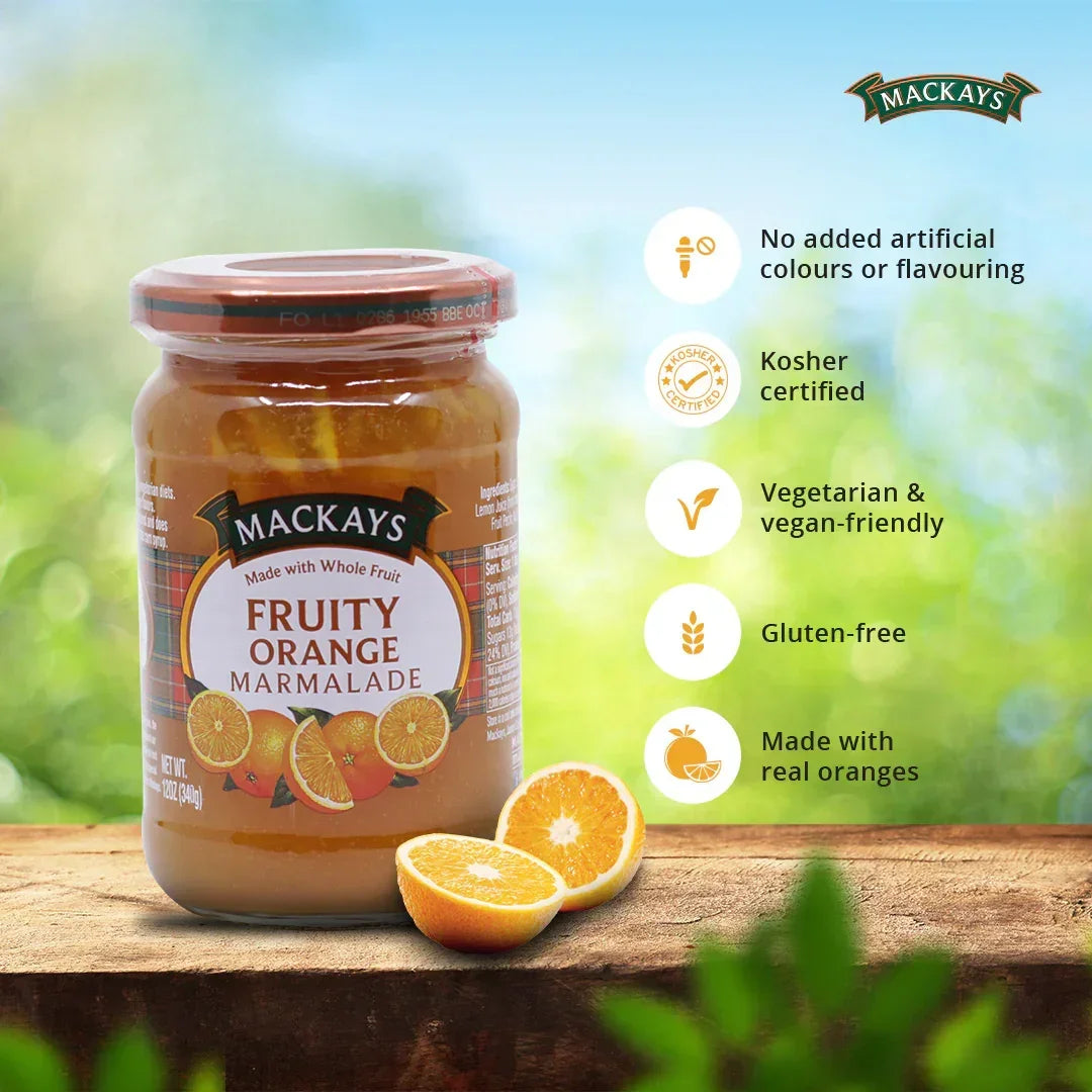 Mackays Fruity Orange Marmalade jar on wooden surface with sliced oranges and health benefit icons