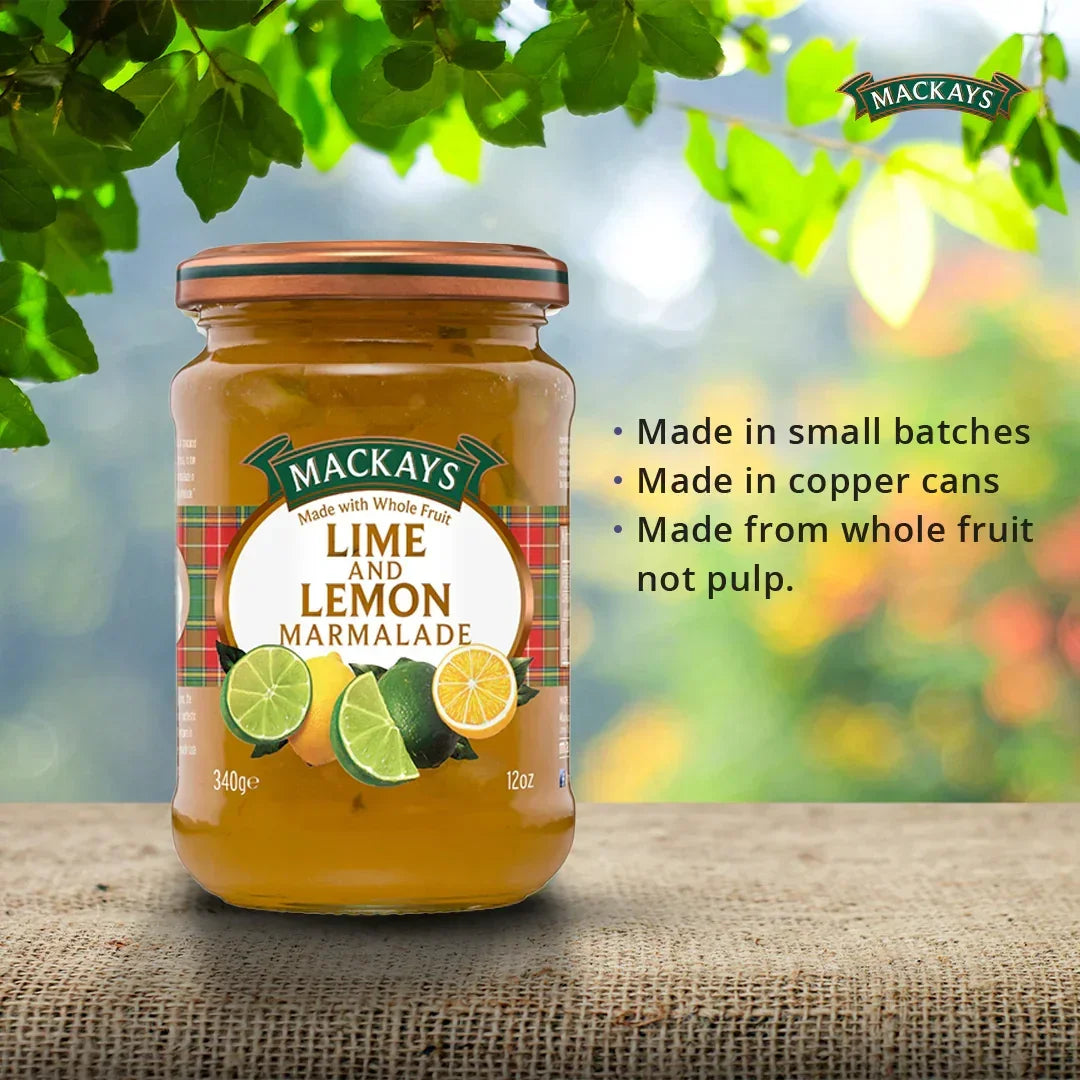 Jar of Mackays Lime and Lemon Marmalade on a rustic surface with leafy background and product features