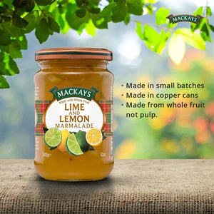 Jar of Mackays Lime and Lemon Marmalade on a rustic surface with leafy background and product features