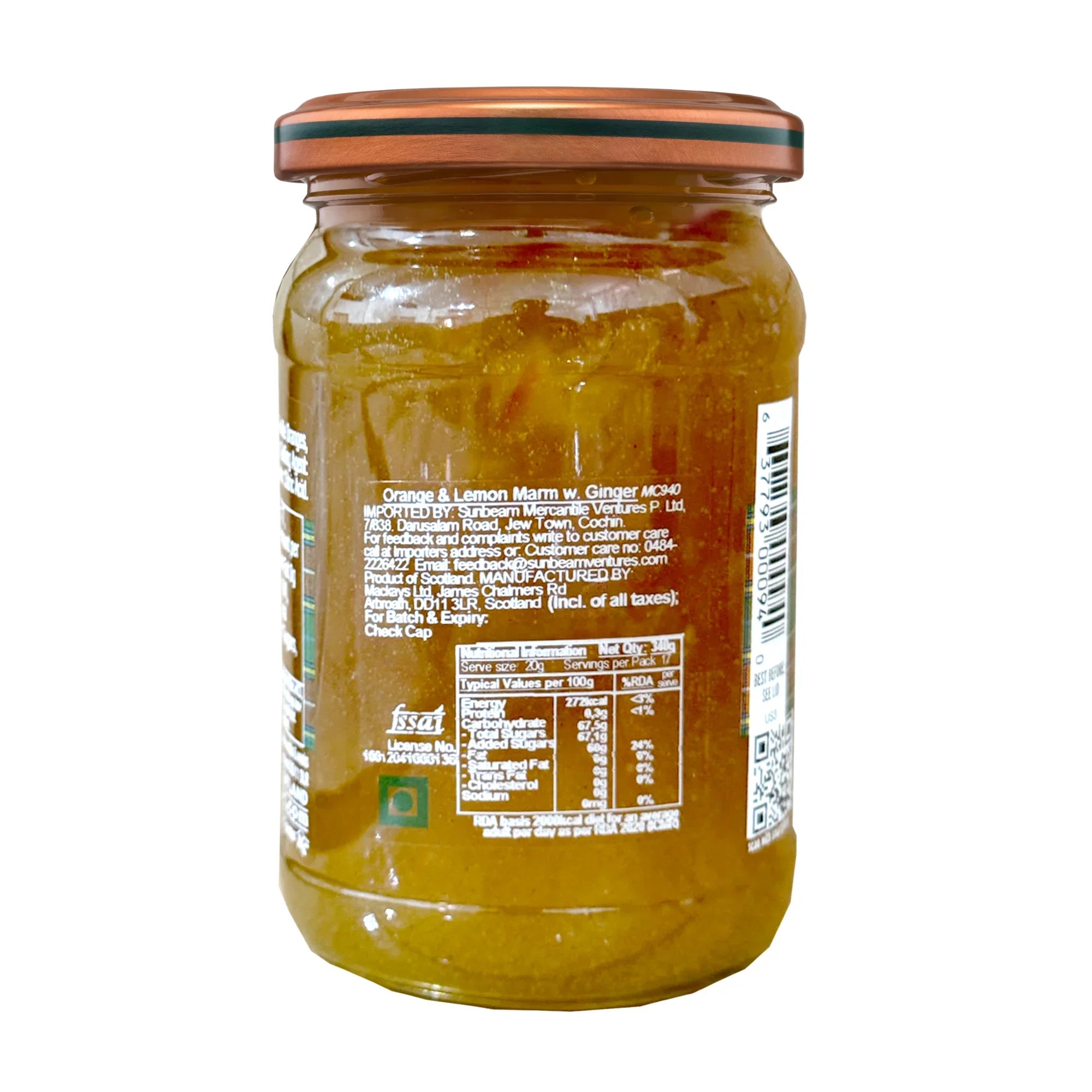 Glass jar of orange lemon ginger marmalade showing nutrition label and ingredients