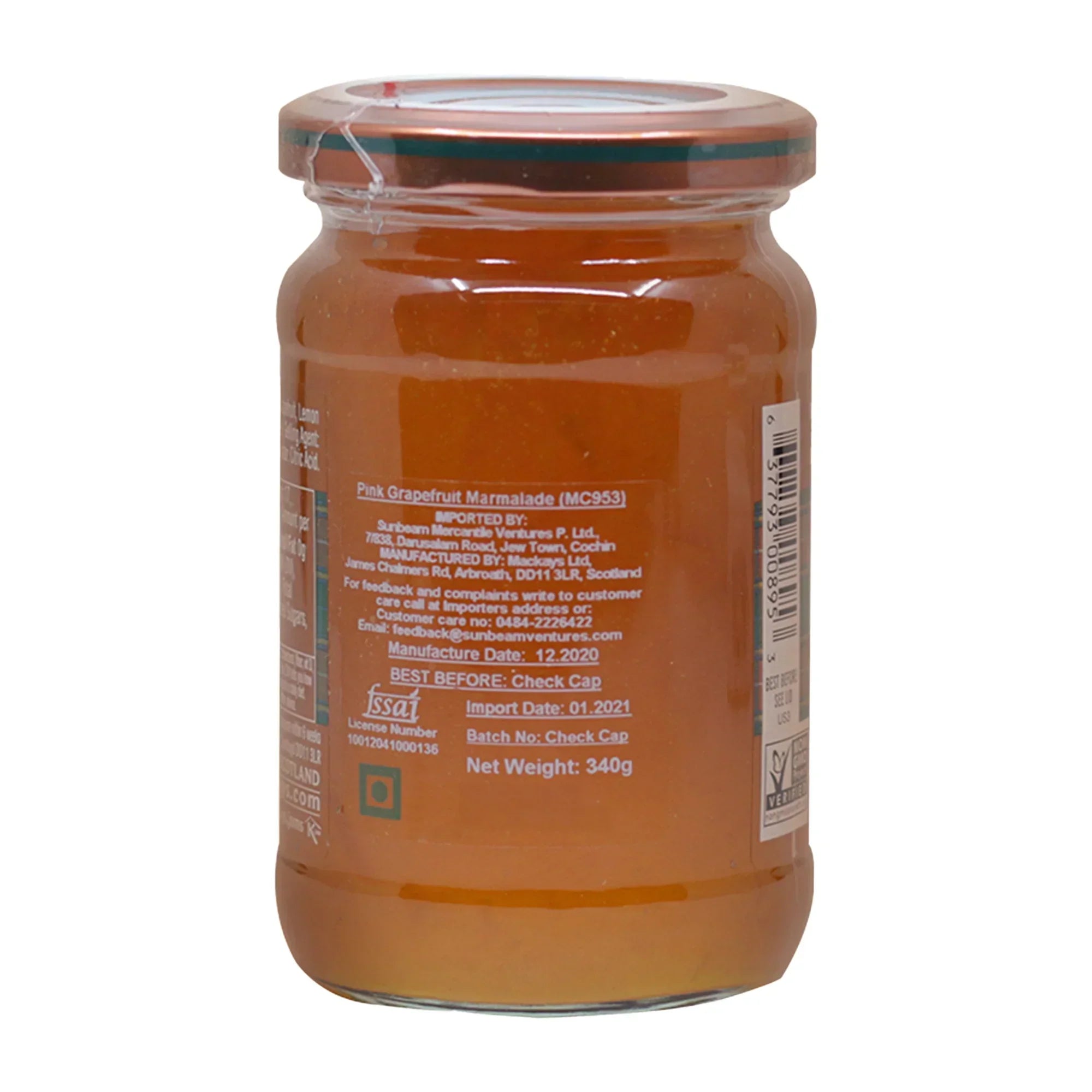 Jar of Mackays Pink Grapefruit Marmalade with orange marmalade visible inside