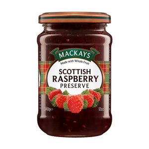 Jar of Mackays Scottish Raspberry Preserve with tartan label and fresh raspberries illustration