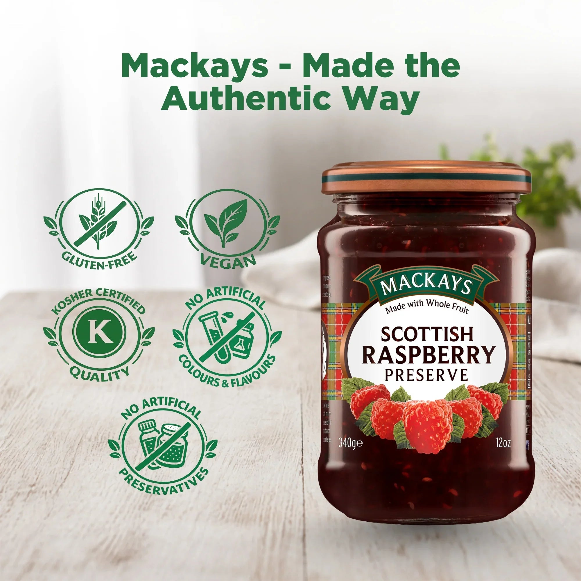 Jar of Mackays Scottish Raspberry Preserve on a wooden table, with gluten-free, vegan, kosher, and no artificial preservatives icons.