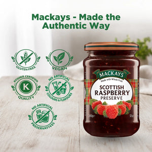 Jar of Mackays Scottish Raspberry Preserve on a wooden table, with gluten-free, vegan, kosher, and no artificial preservatives icons.