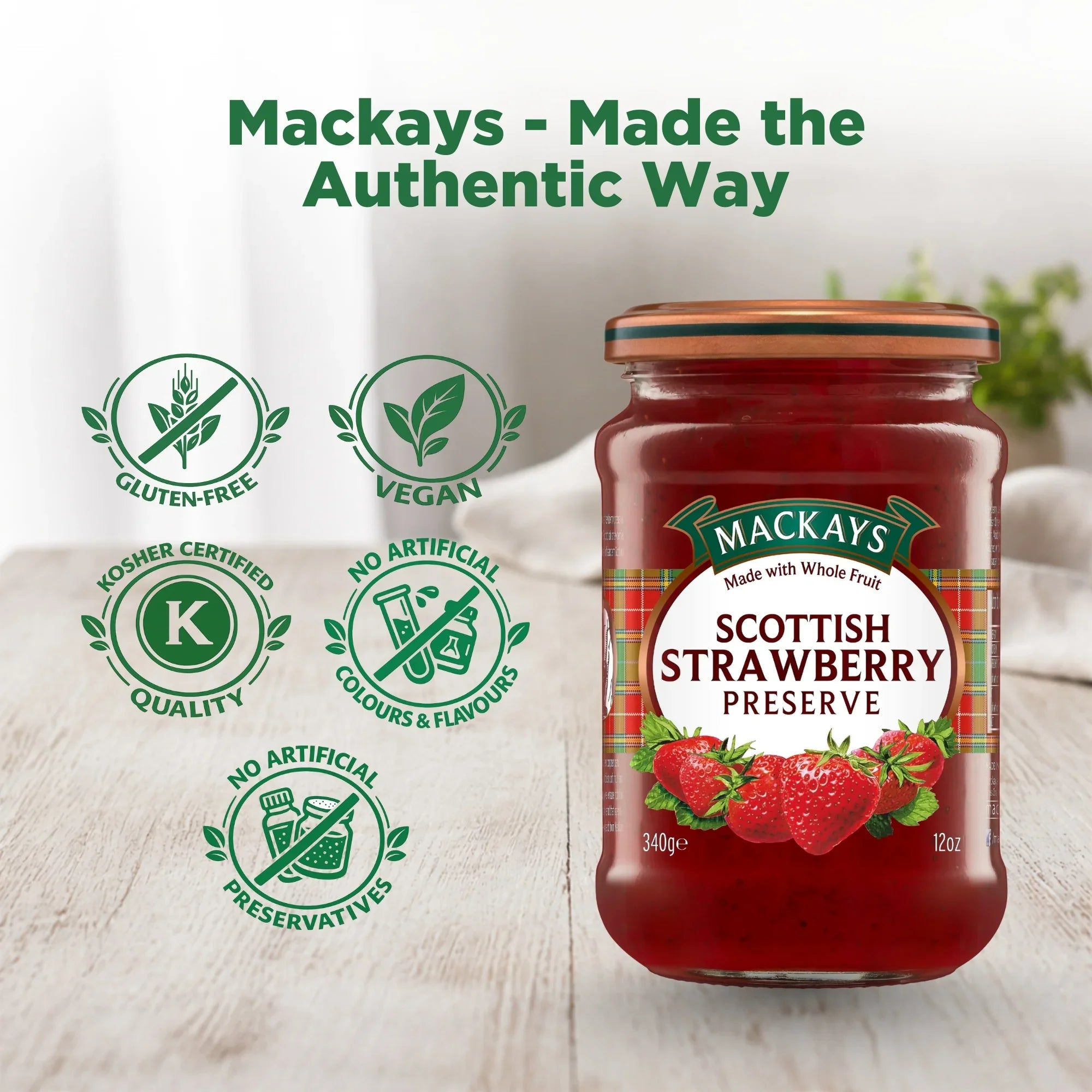 Jar of Mackays Scottish Strawberry Preserve on wooden table, gluten-free, vegan, no artificial colours or preservatives.