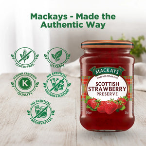 Jar of Mackays Scottish Strawberry Preserve on wooden table, gluten-free, vegan, no artificial colours or preservatives.