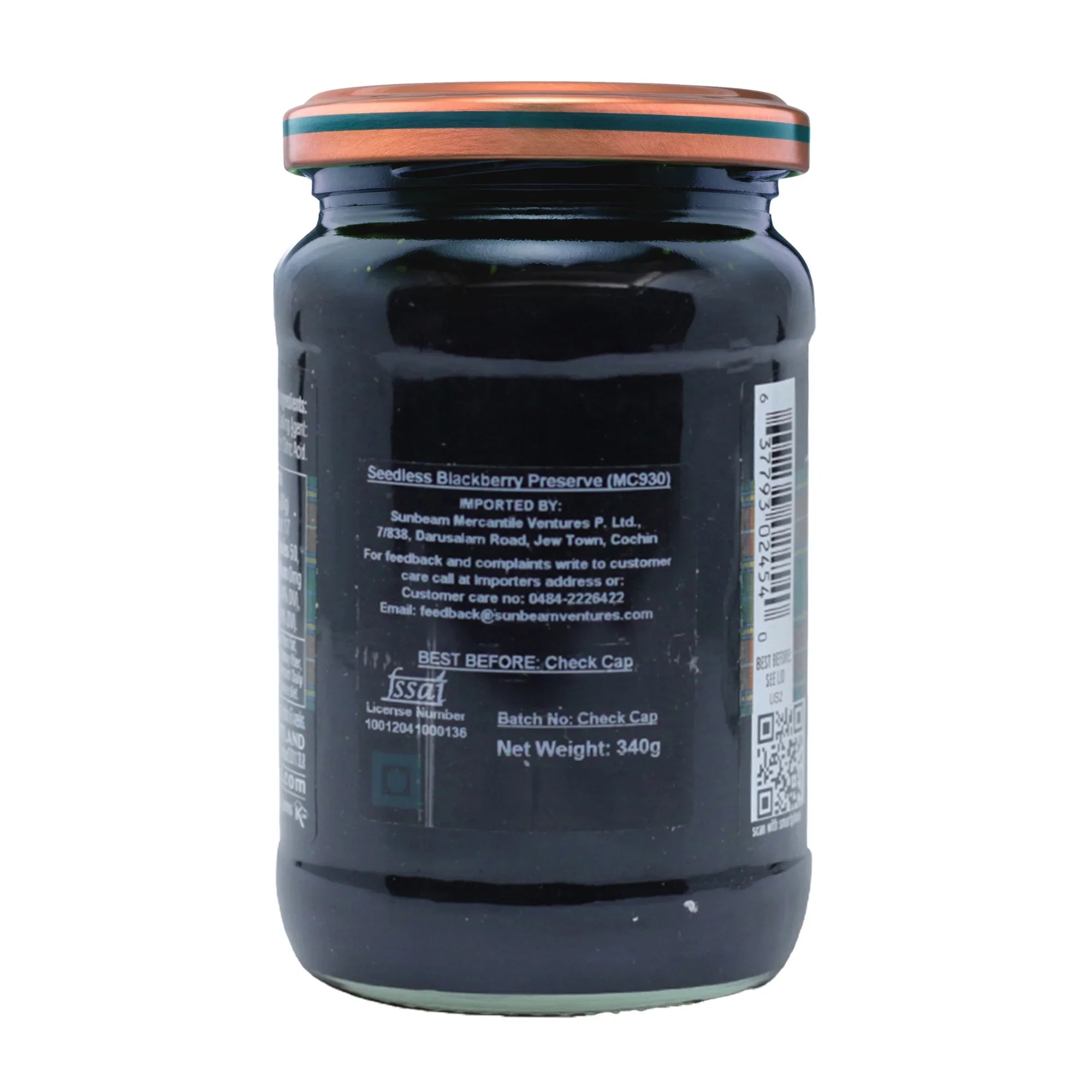 Back label of a glass jar of seedless blackberry preserve, 340g, on a white background